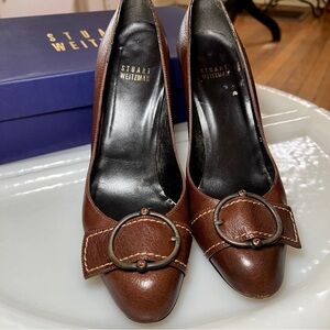 STUART WEITZMAN Buckleup pump. Cacao lama calf. Brown w jewel bead accent S 7